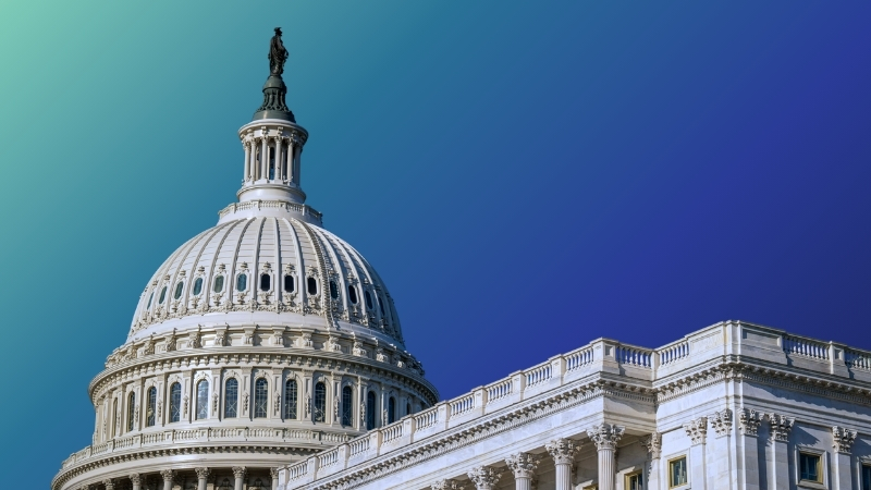 The US Capitol building in front of a blue and mint backdrop